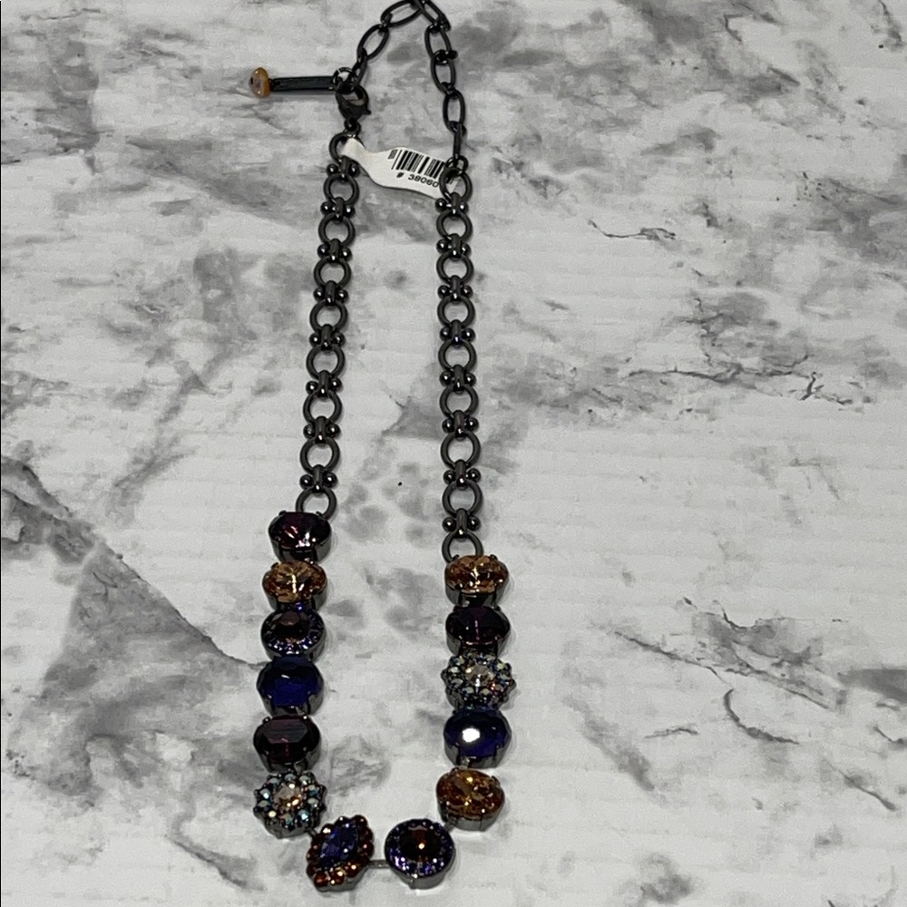 Mariana large cluster necklace with purple and wine color crystals.